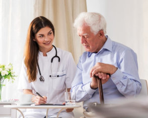 nurse attending to an elderly man