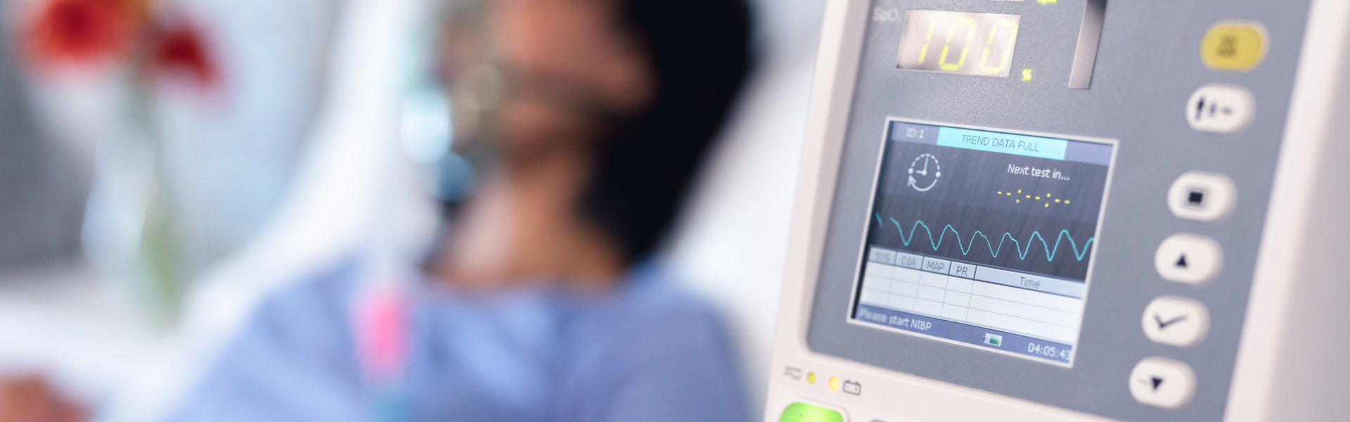 Ventilator monitor and african american female patient in hospital bed with oxygen ventilator